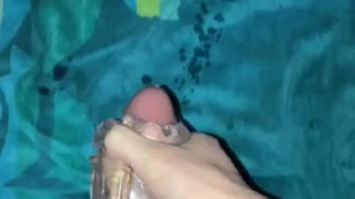 Watching porn and shooting a huge load from my hairy dick with the help of a fleshlight.