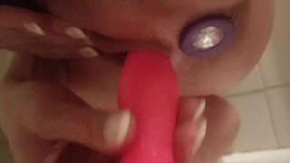 Squirting explosion - She play with a dildo in the shower while having a plug inside!
