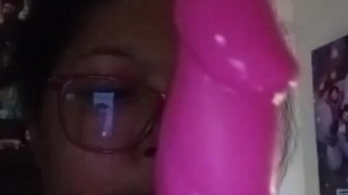 Milf gives pink dildo a blow job