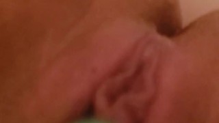 Young milf pleasuring herself in the bathtub
