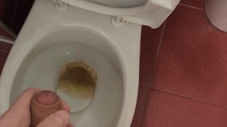 The guy pisses in the toilet for a long time