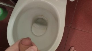 The guy pisses in the toilet for a long time