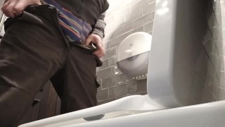  Toilet cam. Pissing in a public toilet
