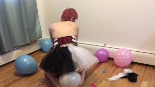 Clown girl pops balloons