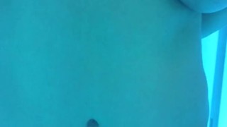 Penelope rubs down in the tanning bed
