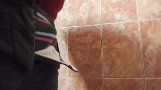 Pissing in a smelly public toilet!
