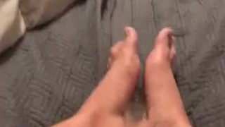 Rubbing a big cock all over my feet