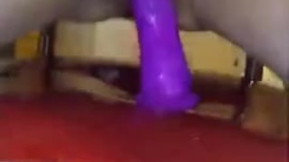 Chair fucking a 8 inch dildo