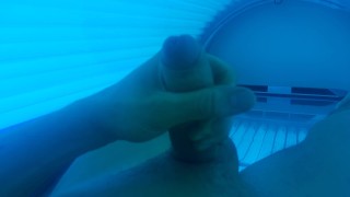 Boy masturbating in solarium