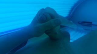Boy masturbating in solarium