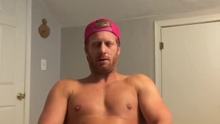 Hot stud jerks cum into condom 