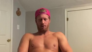 Hot stud jerks cum into condom 