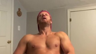 Hot stud jerks cum into condom 