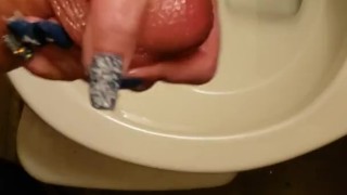Real amateur girlfriend holds my big white dick and controls my piss while I pee in the toilet 