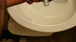 Real amateur girlfriend holds my big white dick and controls my piss while I pee in the toilet 