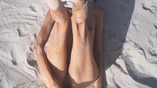 Tight Pussy takes a Hot Golden Shower while being Penetrated by a Cucumber on the Beach
