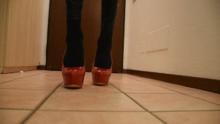 Fuchsia Doll walking in red high heels