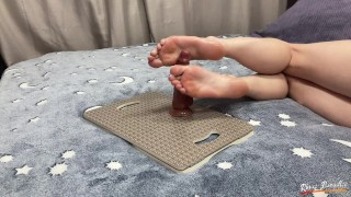 A student decided to play with a dildo after classes. Footjob with a dildo. Perfect feet. Footfetish