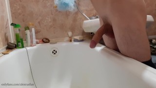 Russian teen with big dick pisses in the bathroom and cums