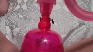 Pumping up pussy and clit with pussy pump making her swell 