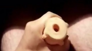Penetrating fleshlight all the way and cumming