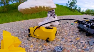 Big excavator is destroyed kicked, trampled, crushed, smashed, crushed, broken plastic car, crush