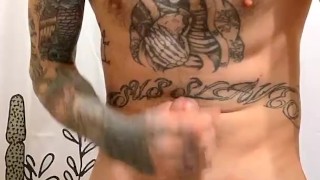 Sexy tattooed guy jerks off