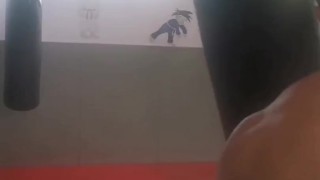 Boxing the heavy bag. Real-life bad boy and straight porn actor working out.