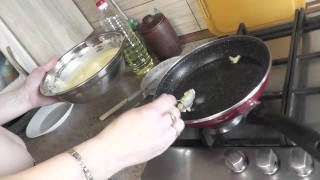Nude kitchen . Naked mommy Milf DuBarry in pantyhose without panties prepares next dish. Home nudist