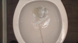 Slow stroking my dick while I piss