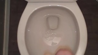 Slow stroking my dick while I piss