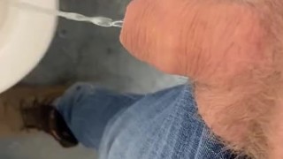 Small uncut cock pissing in public bathroom