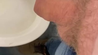 Small uncut cock pissing in public bathroom