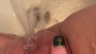Horny hot thick MILF wiggles hips and uses bath tub faucet to get off in bathtub