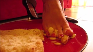 High heels and barefoot crush of a cream cake