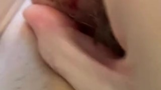 Oiling up that hairy pussy and moaning
