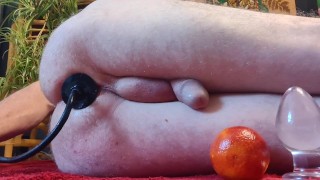 Stretching my ass with glass plug, anal inflatable plug. Then the ass swallowed the orange.( Part 1