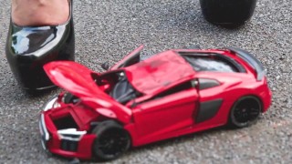 Crush of Red Audi R8 model toy car with Black Pump Stilettos