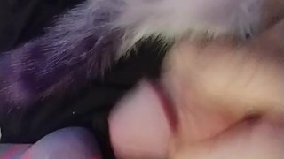 Horny slut in knee highs with a plug tail cums closeup