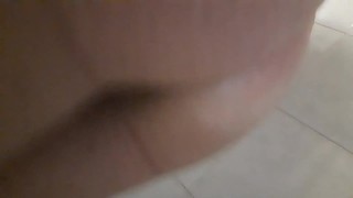 Showering with my girlfriend's black dildo up to my ass.