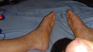 Watching porn while stroking dick with wrinkled male soles