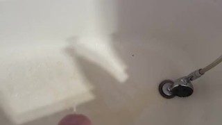 Just a hard cock peeing in the tub