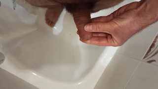 Peeing in the bathroom.