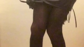 Fuchsia Doll in nylon bodysuit, leather miniskirt, show ass