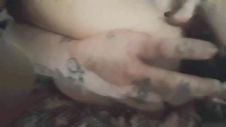 Sexy tattooed milf gets down and dirty with her toys...