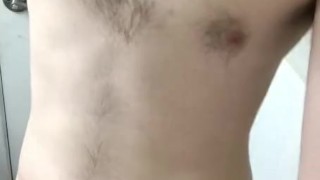 Slim guy getting ready to shower