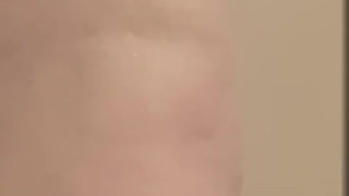 Milf seductively showers and plays with large, pierced breasts and horny, pierced pussy