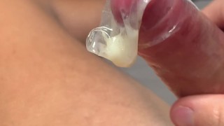 British boy jerks off and shoots his load into a condom (lots of hot thick cum)