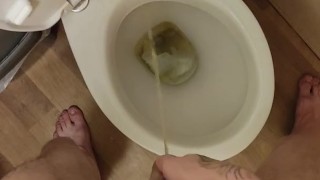 Skinny teen with erected cock takes a piss