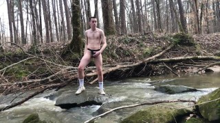 19 year old Jesse Gold jerks off and cums in a river then almost gets caught